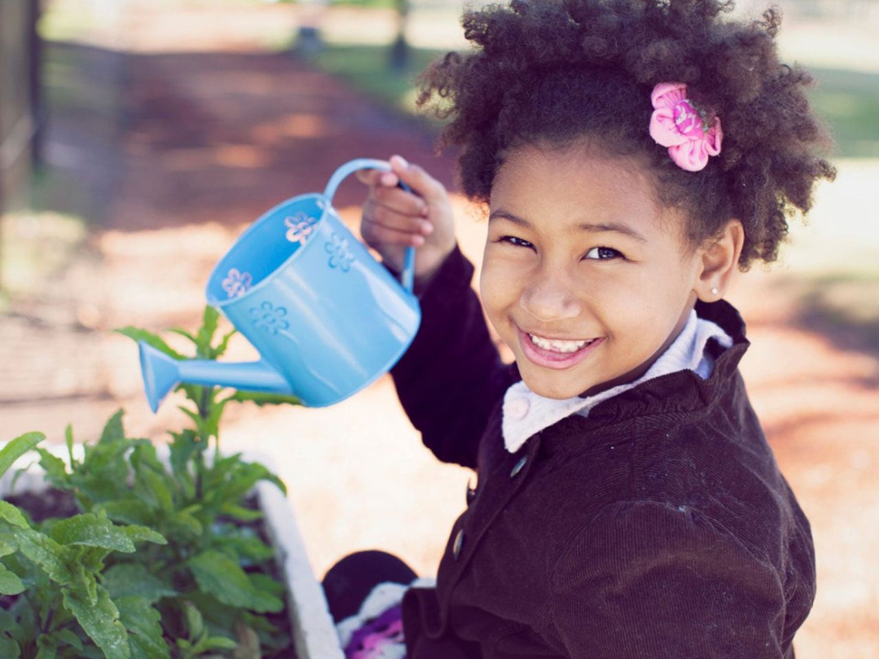 Child Watering Plants