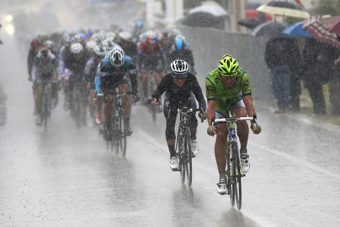 The Cannondale rider stands out in the downpour