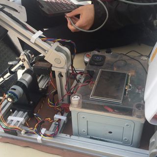 The IVO robot includes simple accelerometers and other sensors to help navigate any type of car. Here, the robot's "torso" sitting in the driver's seat.