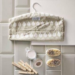 white tiles with clothes scrubber and clip on it