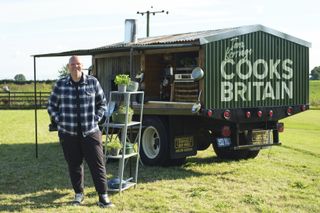Tom Kerridge with his truck, showing off the kitchen.