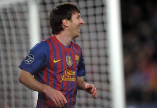 Lionel Messi of Barcelona celebrates after scoring one of his five goals against Bayer Leverkusen during the Champions League last 16 second leg match at the Camp Nou, March 2012