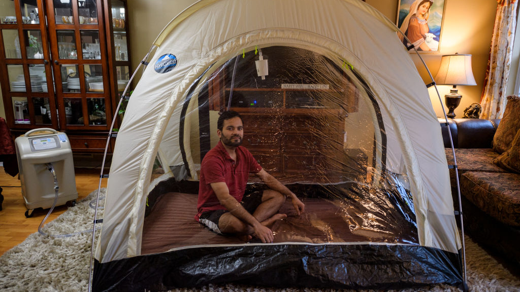 Climber Akash Negi sits in a Hypoxic tent
