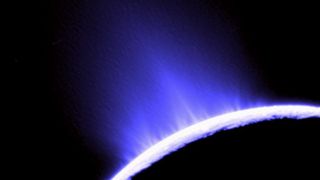 Silhouette of a dark planet spraying a stram of icy blue particles into space
