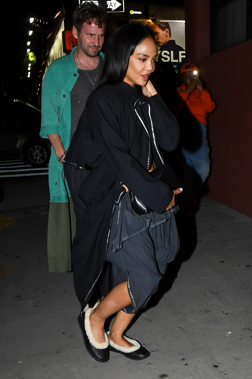Tessa Thompson wearing a black jacket and skirt with Ugg Zora ballet flats in NYC