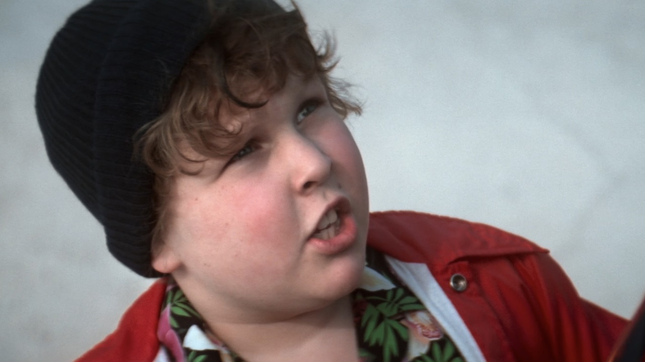 Jeff Cohen as Chunk looking up at Sloth in The Goonies