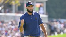 Scottie Scheffler celebrates a putt in the Presidents Cup at Royal Montreal Golf Club