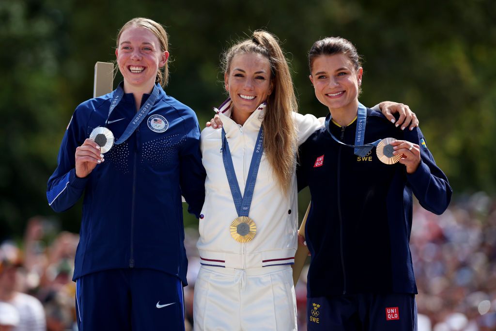 ELANCOURT FRANCE JULY 28 Gold medalist Pauline Ferrand Prevot of Team France C Silver medalist Haley Batten of Team United States L and Bronze medalist Jenny Rissveds of Team Sweden R pose on the podium during the Womens CrossCountry Cycling Mountain Bike Gold Medal race on day two of the Olympic Games Paris 2024 at Elancourt Hill on July 28 2024 in Elancourt France Photo by Jared C TiltonGetty Images