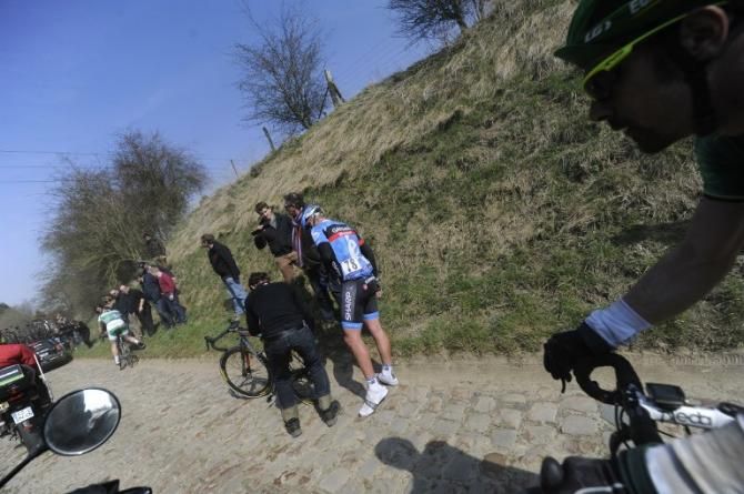 Belgium's Sebastien Rosseler (Garmin-Sharp) waits for his bike to be fixed after a puncture