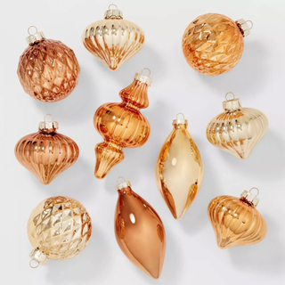 A set of copper Christmas ornaments in varying shapes