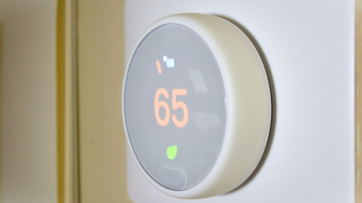 Nest Thermostat E smart thermostat (which is number five in our guide, mounted on wall, showing the current ambient temperature in Eco Mode
