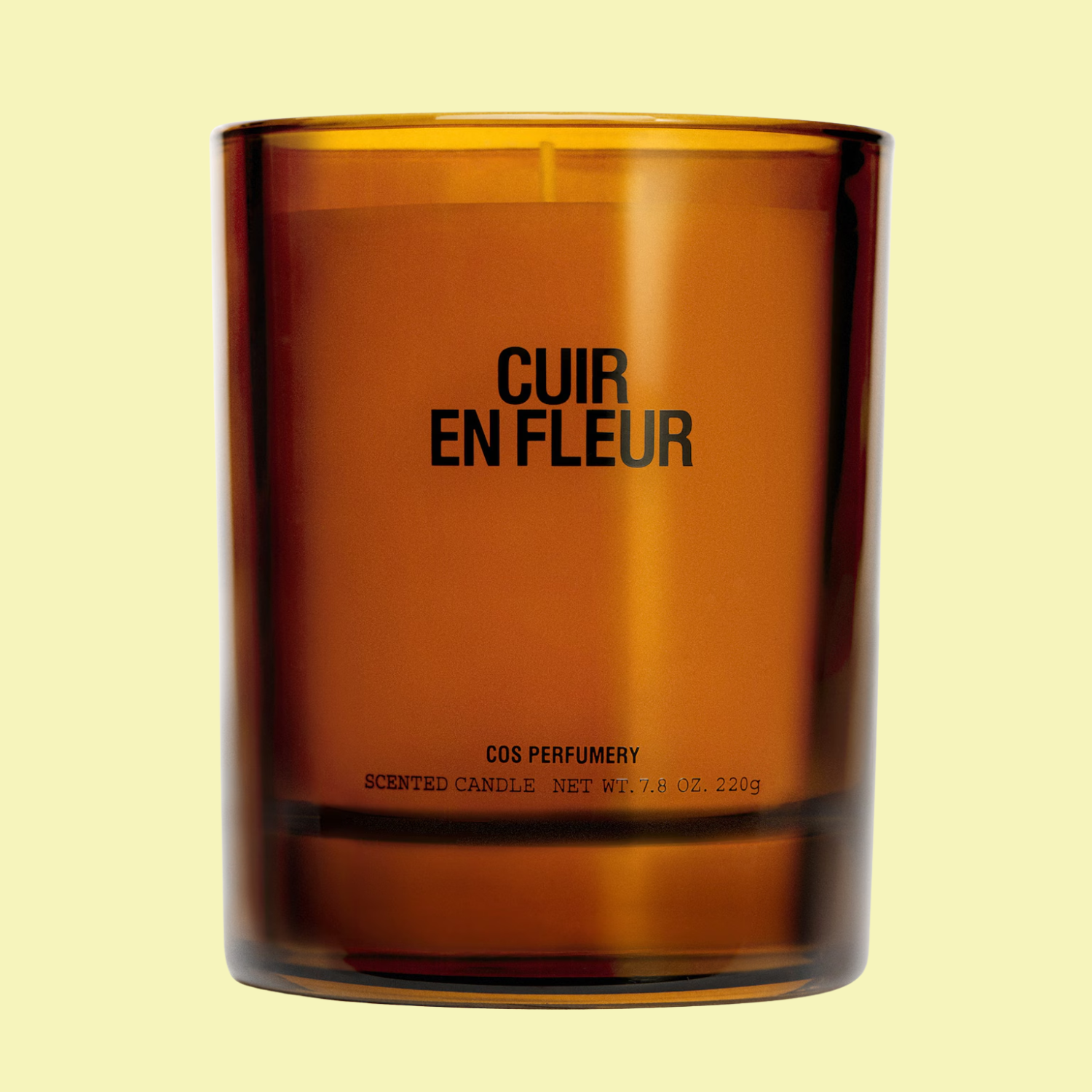 A candle in an amber glass