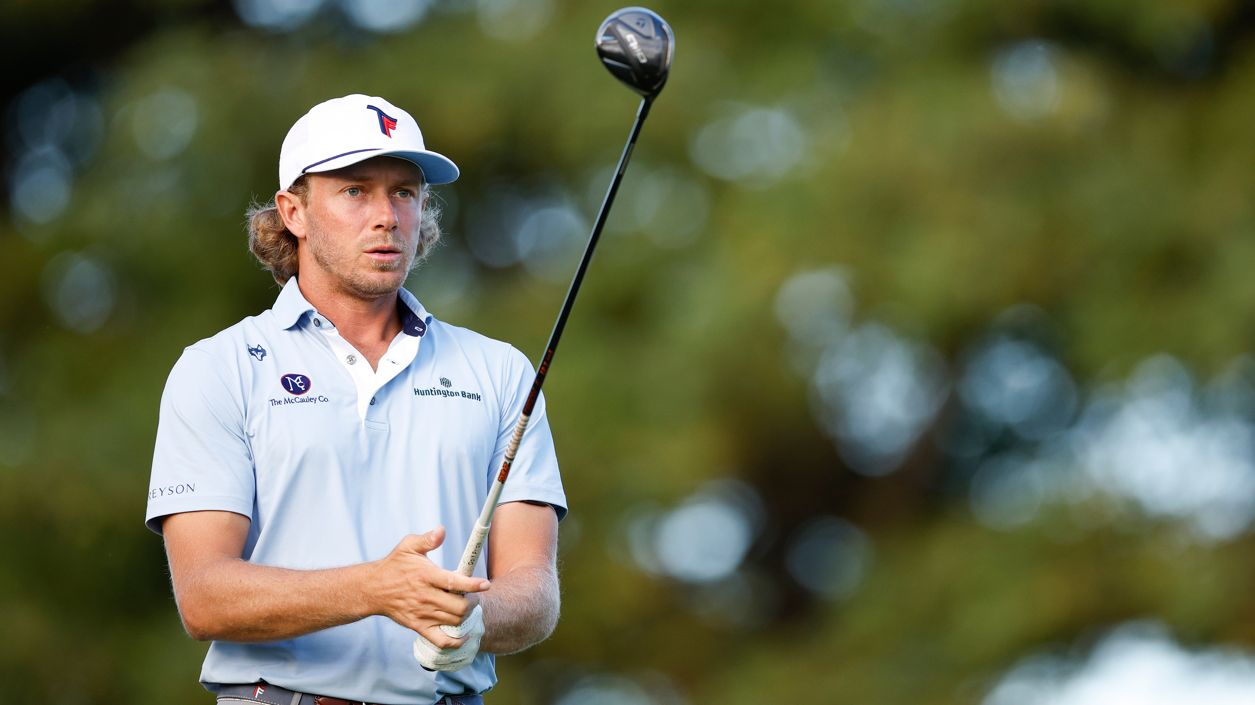 Austin Smotherman lines up a fairway wood shot