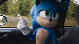 Sonic (voiced by Ben Schwartz) sits in a truck in the first Sonic movie