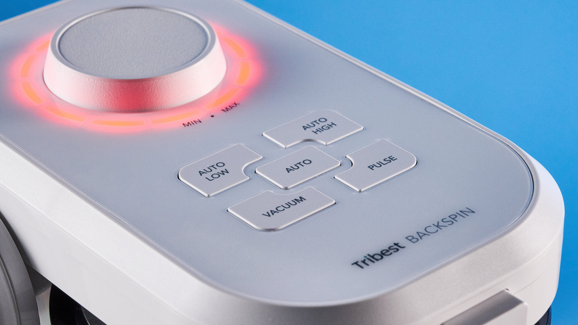 Controls of the Tribest Backspin Blender photographed in front of a blue background