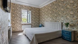 A room covered with floral wallpaper