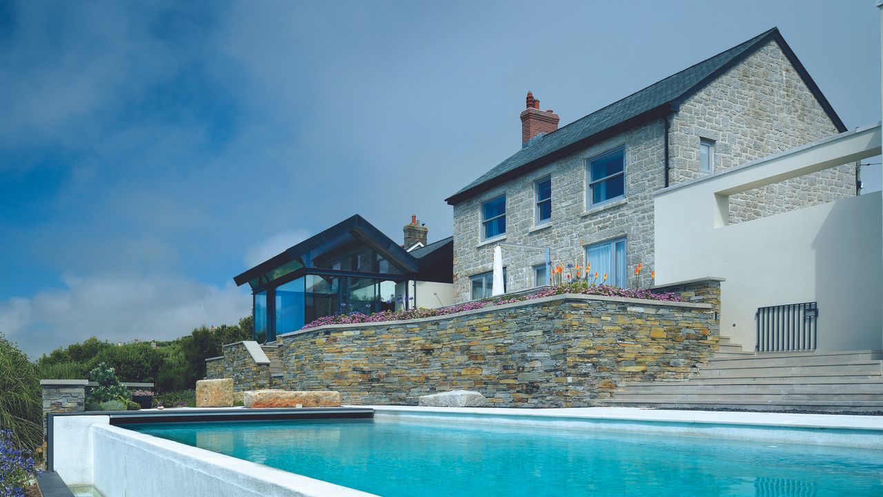 granite cottage with glass extension and swimming pool