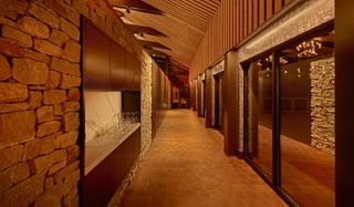 A corridor with wooden and stone accents