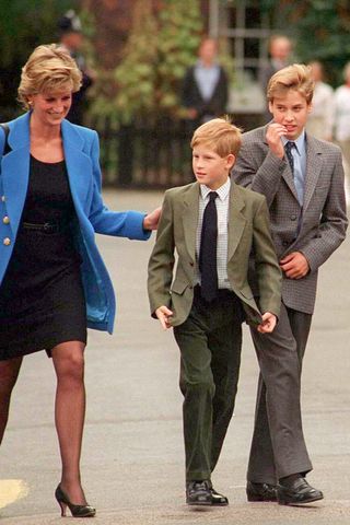 Prince William with Princess Diana and Prince Harry on the day he joined Eton in 1995