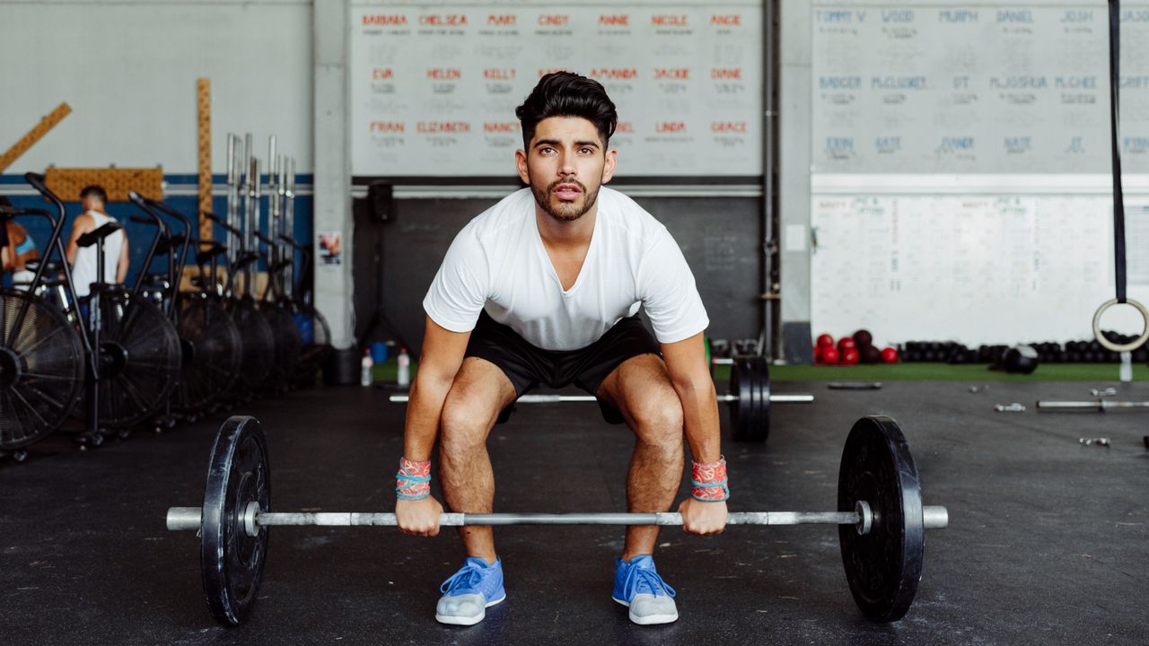 Man preparing to do a barbell squat