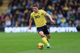 Cameron Brannagan of Oxford United runs with the ball during the Sky Bet League One match between Oxford United and Reading at Kassam Stadium on February 03, 2024 in Oxford, England. (Photo by Cameron Howard/Getty Images)