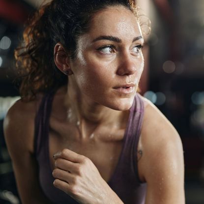 a woman with a sweaty face while working out