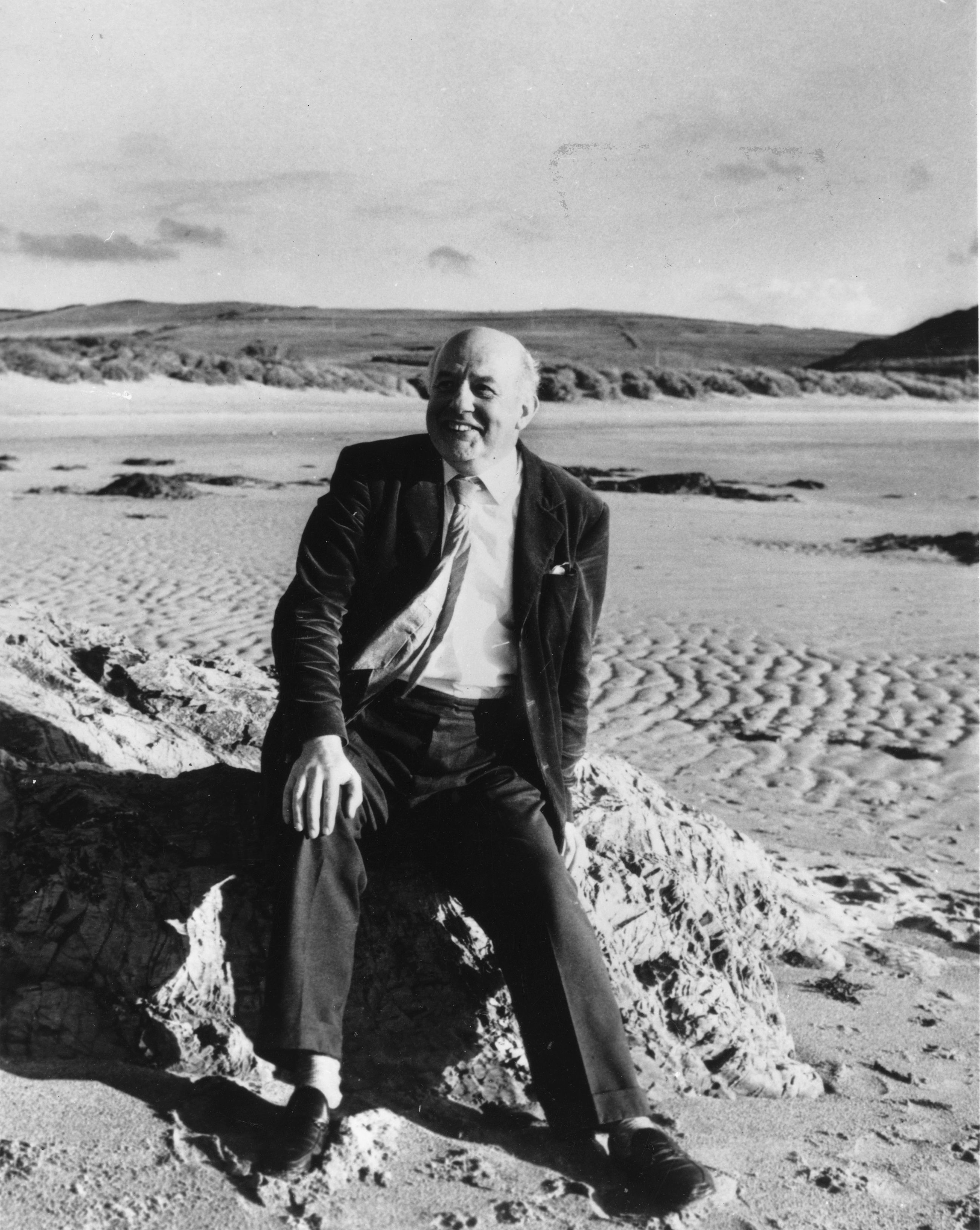 British poet Sir John Betjeman on the beach at Trebethwick, Cornwall, after being officially appointed the new poet laureate.
