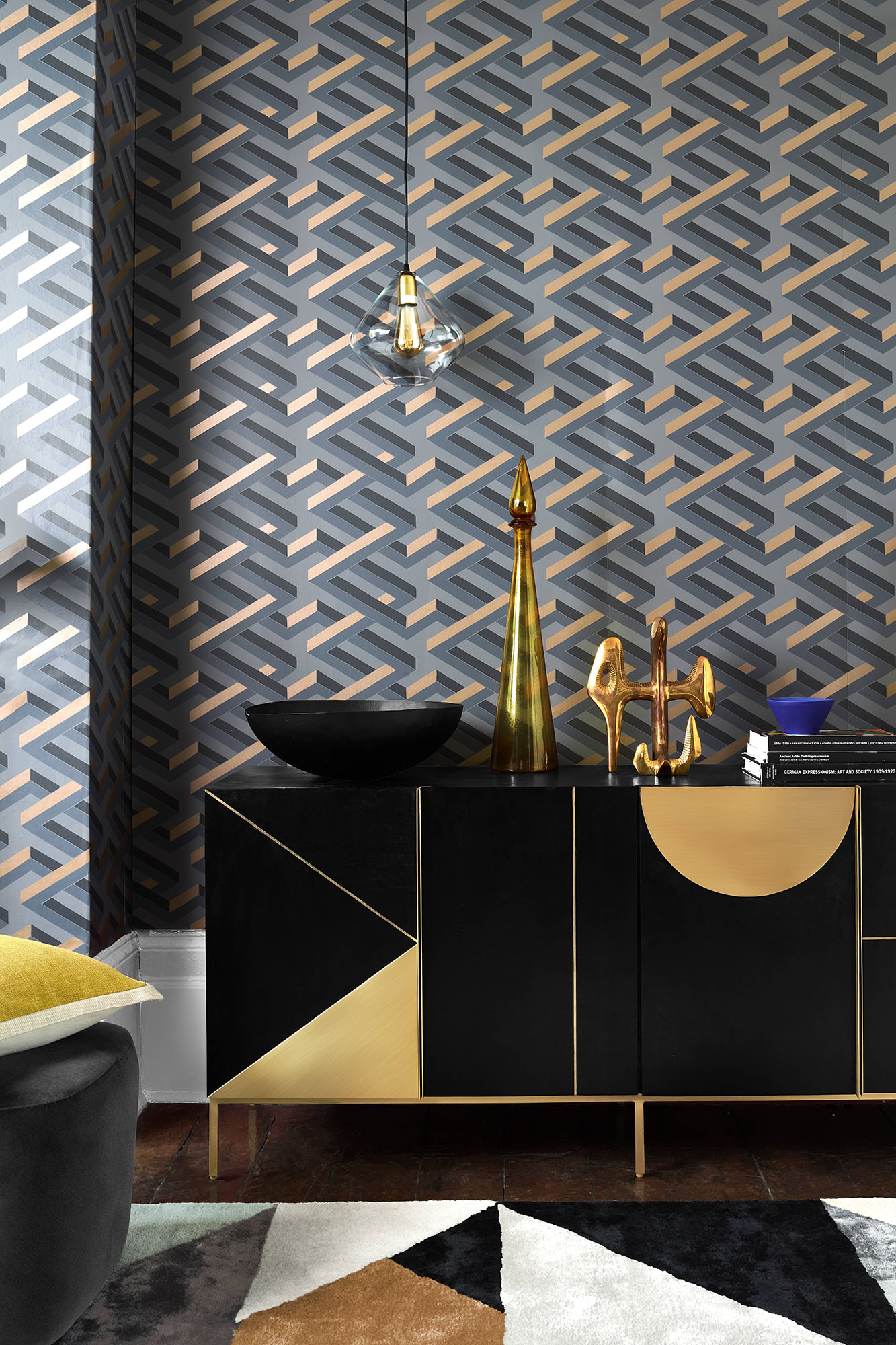 statement black sideboard in a modern living room with geometric wallpaper