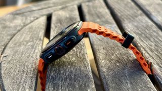 A side view of the Samsung Galaxy Watch Ultra sitting on a table.