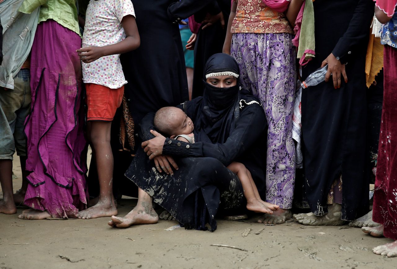 Rohingya refugees wait to receive aid in Cox&amp;#039;s Bazar, Bangladesh.