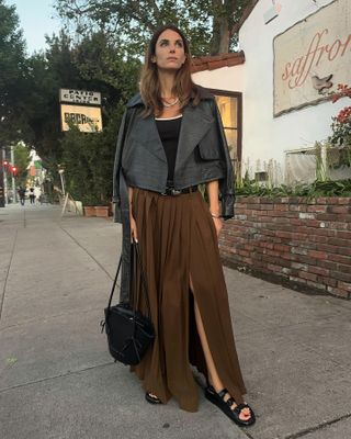 Influencer wearing a brown skirt.