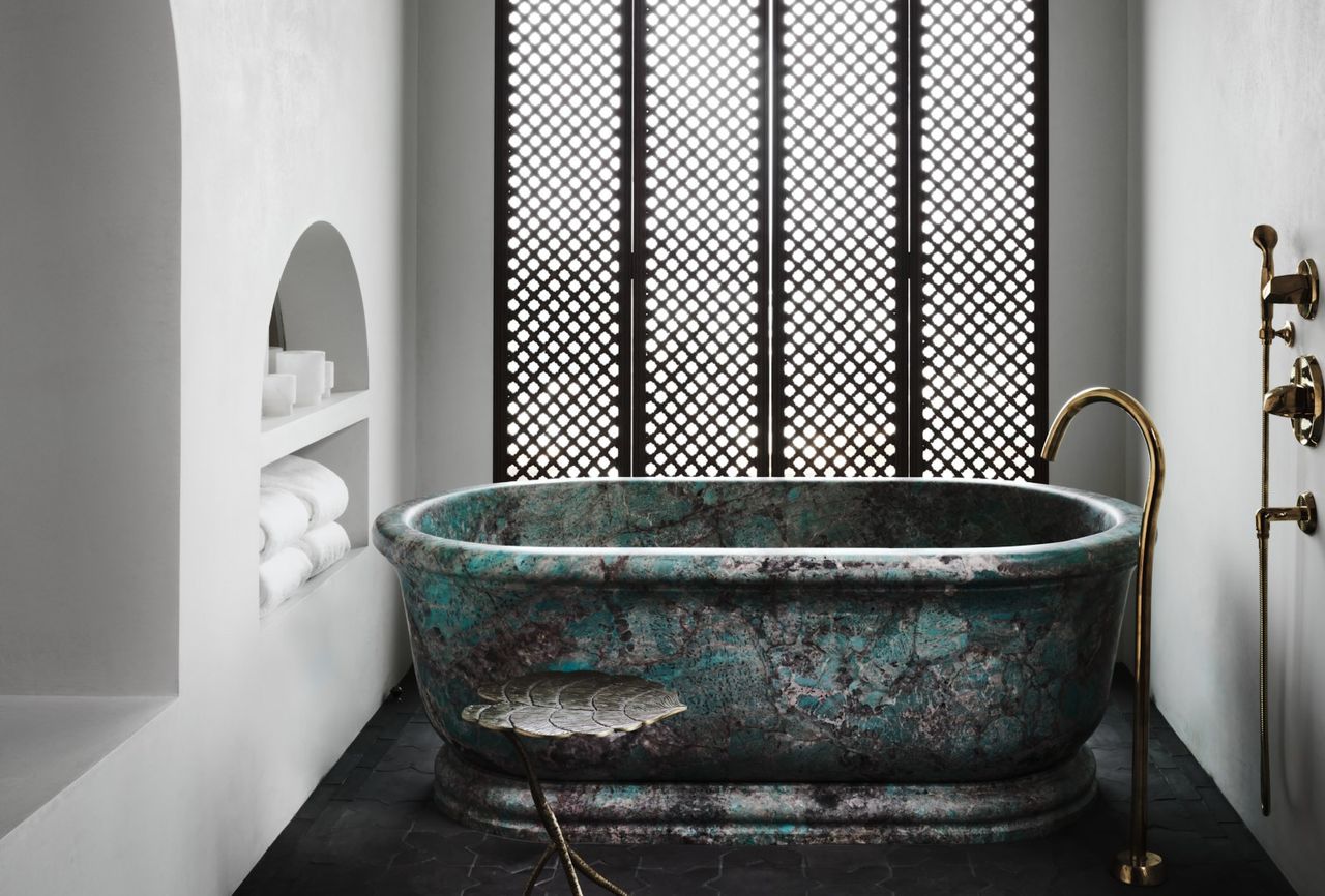 A natural bathroom with amazonite tub