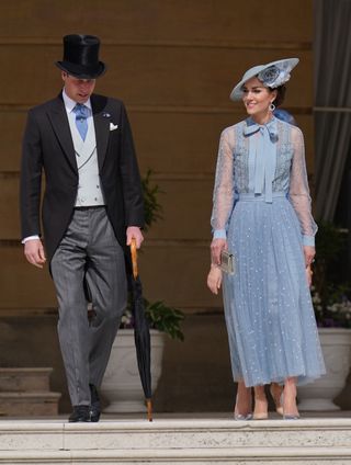 Prince William and Kate Middleton attend a garden party in blue