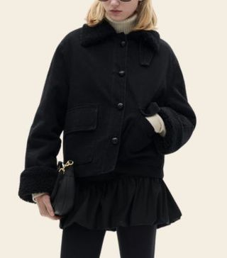 Image of woman wearing black coat