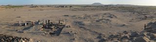 a panoramic photo of an excavation site in the desert