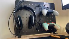 Thermaltake Gaming Desk Pegboard (Medium) with 2x controller, 1x headset, 1x hook, and 1x pin magnet accessories