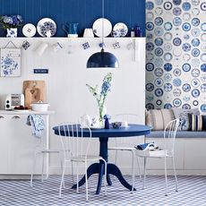 room with blue table and white chairs