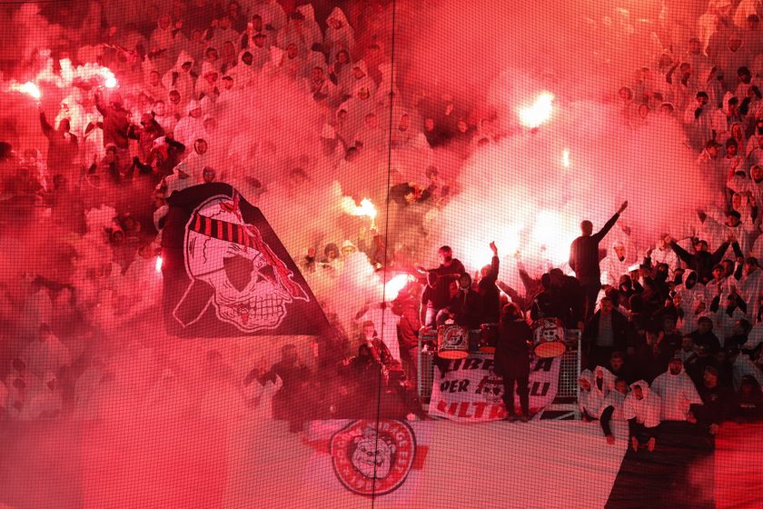 Nice&#039;s fans cheer their team with smoke flares during the French L1 football match between OGC Nice and Olympique de Marseille (OM) at the Allianz Riviera stadium in Nice, south-eastern France, on November 21, 2025. (Photo by Valery HACHE / AFP)