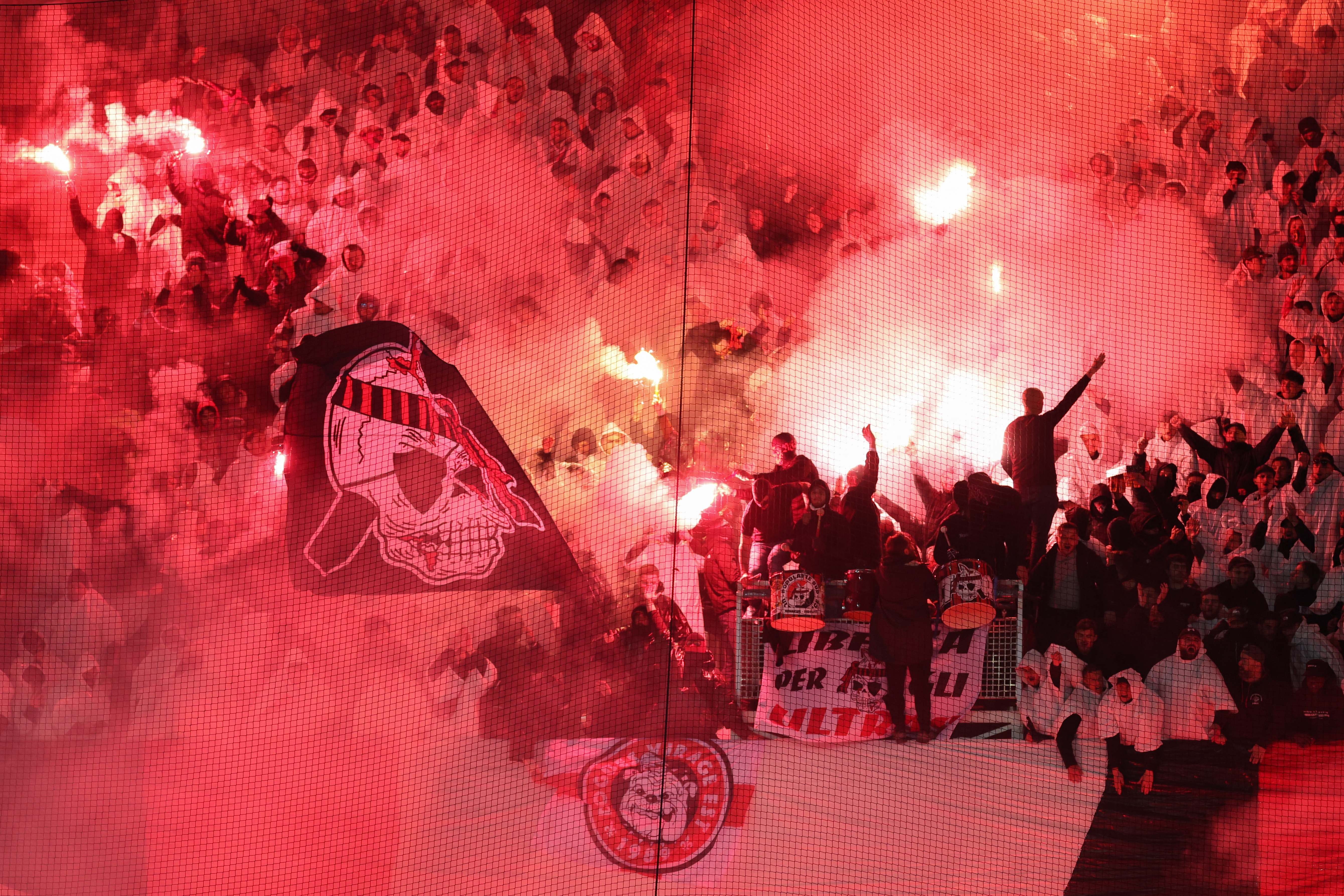 Nice&#039;s fans cheer their team with smoke flares during the French L1 football match between OGC Nice and Olympique de Marseille (OM) at the Allianz Riviera stadium in Nice, south-eastern France, on November 21, 2025. (Photo by Valery HACHE / AFP)