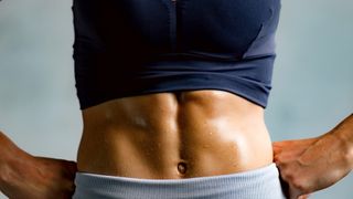 a photo of a woman with strong abs
