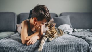 Young child with Somali cat