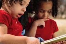 Two girls reading