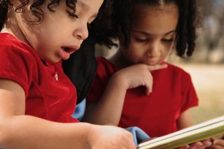 Two girls reading