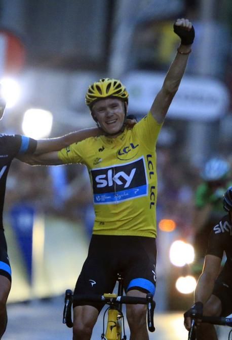 Chris Froome (Sky) celebrates his overall victory in the 100th Tour de France