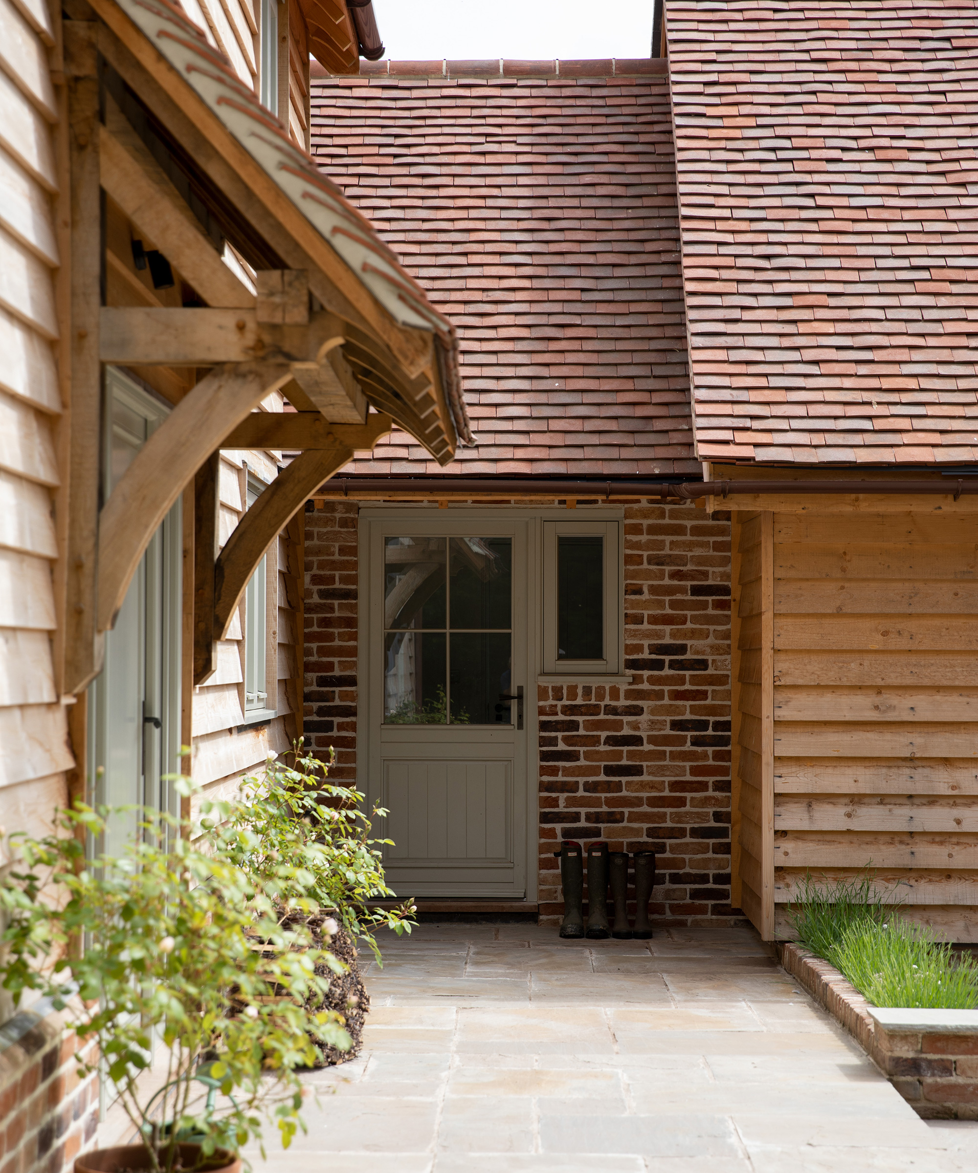 small canopy over front door on oak frame house