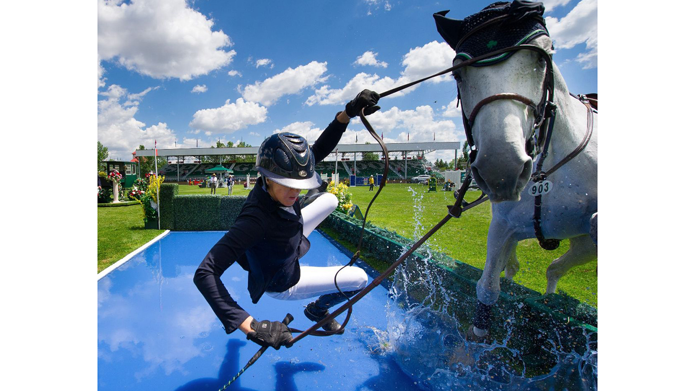 Kelly Soleau-Millar (USA) with an unplanned dismount at the new open water jump at Meadows on the Green