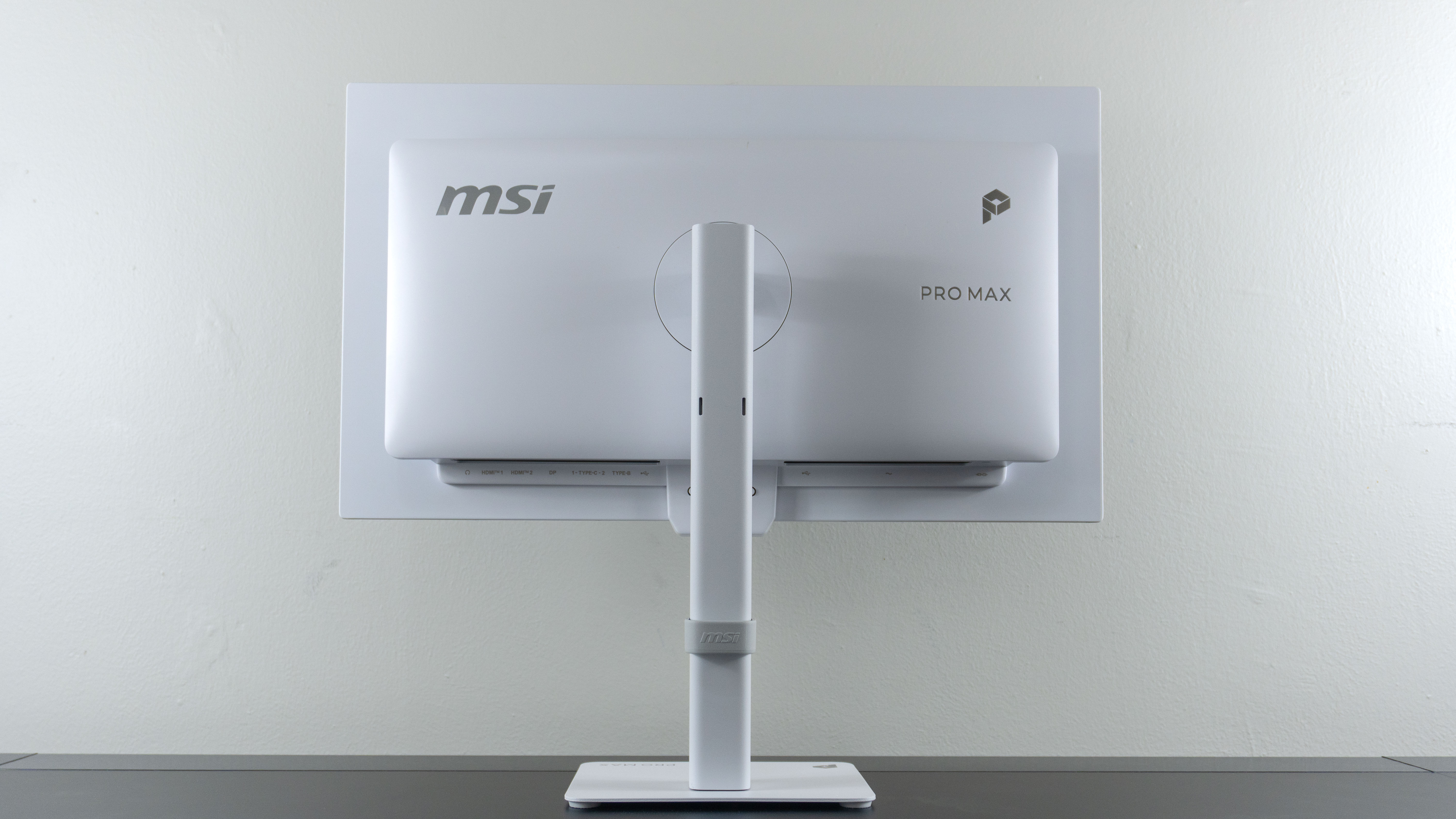 The backside of the MSI Pro Max 271UPXW12G monitor showing off the included all metal stand