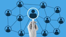 A greyscale hand holding a magnifying glass up to a network of silhouettes on a blue background, with one magnified in the glass, to represent HR technology.