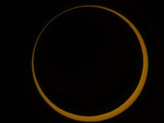 a ring of orange light against a black background