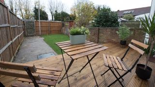 small garden with lawn and decking